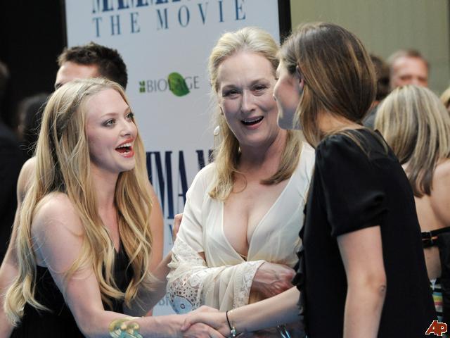 Actress Amanda Seyfried, left, greets actress Meryl Streep, center Actress Amanda Seyfried, left, greets actress Meryl Streep, center
